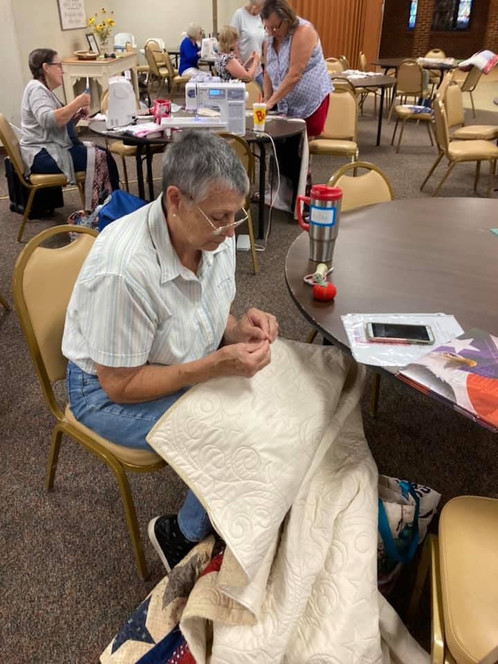 Image of woman quilding
