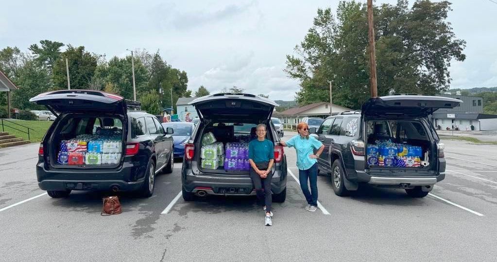 Volunteers collecting water for flood victims