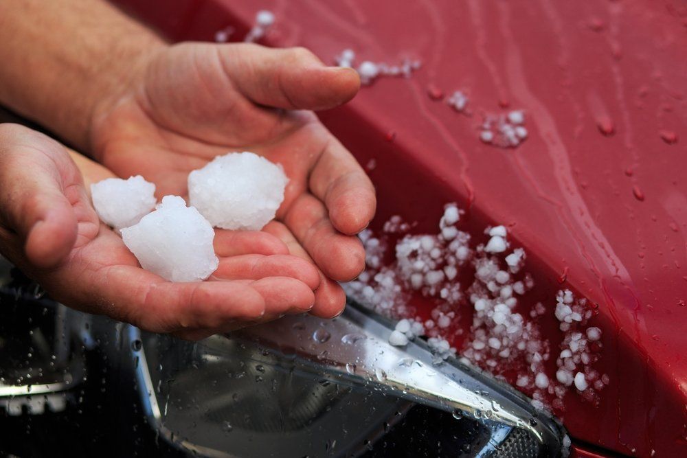 Closeup of large hail stones on ground