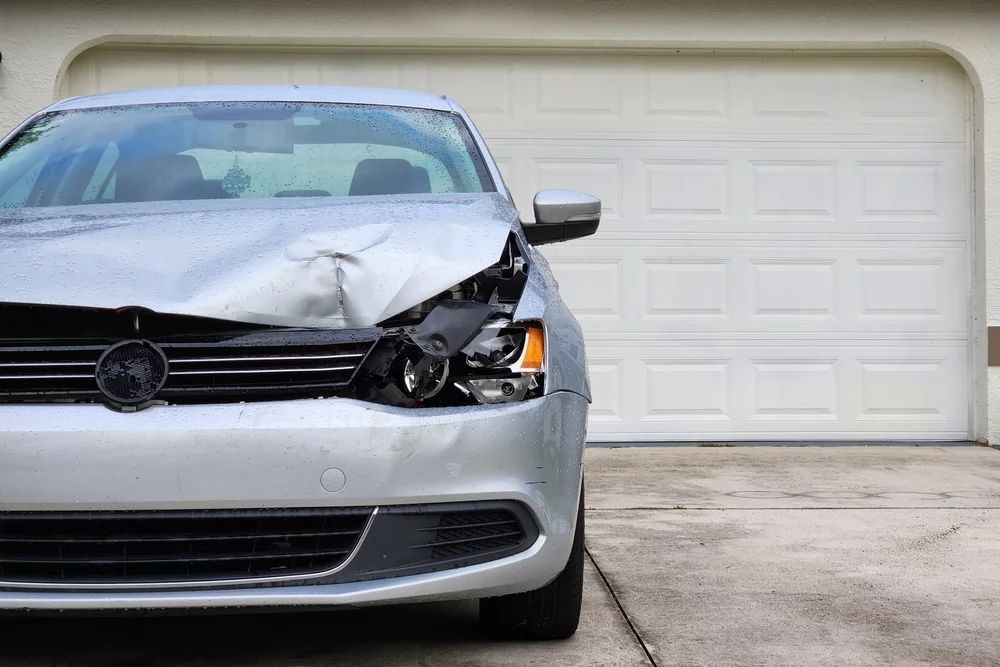 Damaged car in driveway