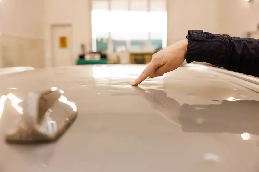 A driver unfortunately finds damage, wondering if they should claim hail damage on their car.
