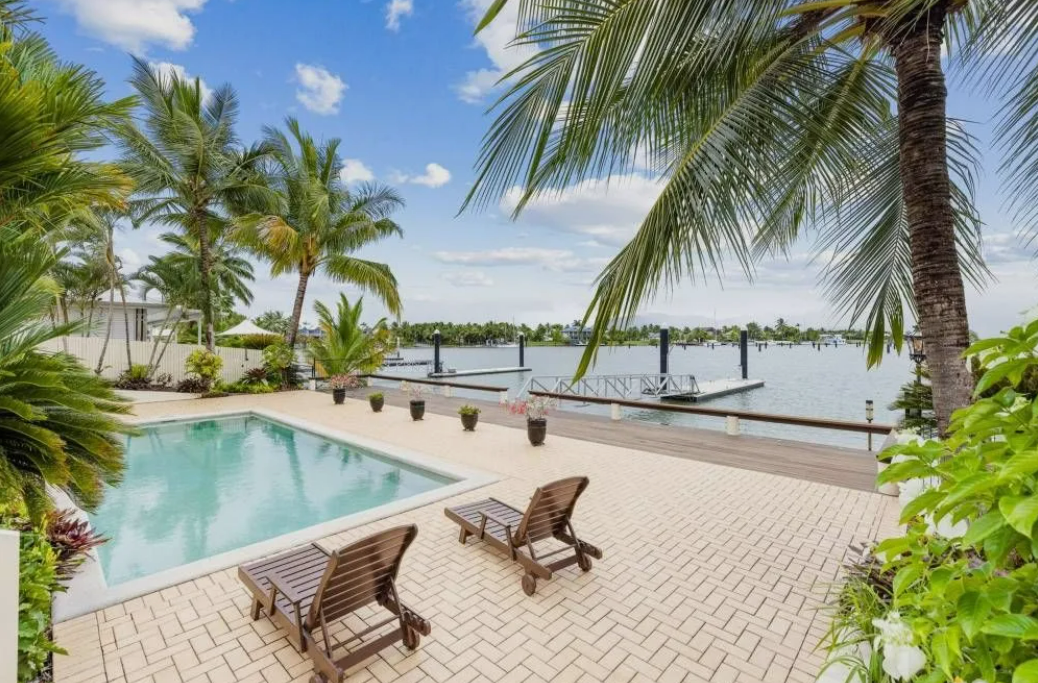 Poolside View of a House With Palm — MDSR Group In Manunda, QLD