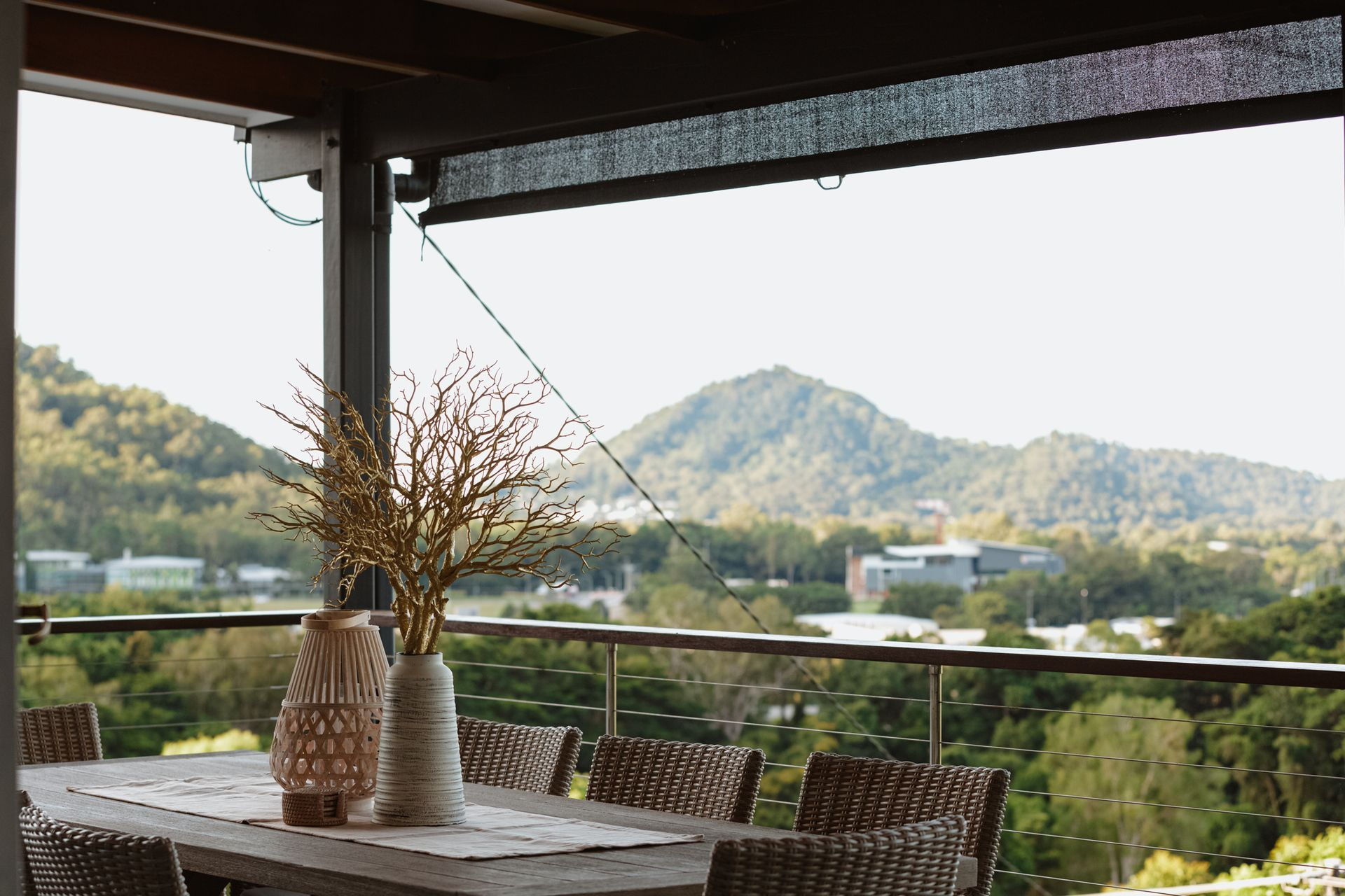 Outdoor Dining Table on a Deck With Mountain View — MDSR Group In Manunda, QLD