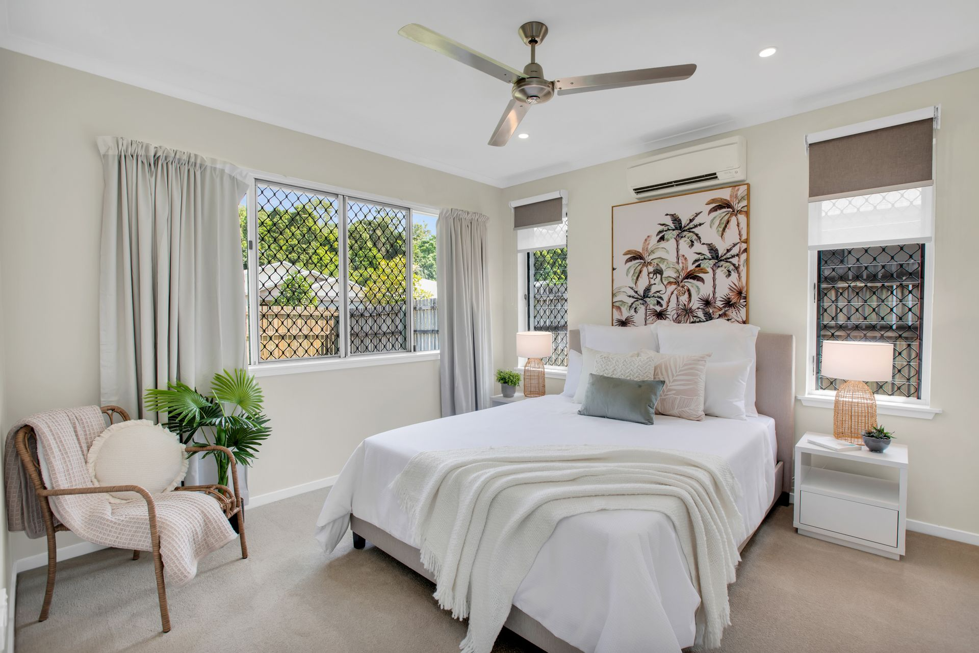 Bedroom With Bed, Chair, Windows, and Neutral Colors — MDSR Group In Manunda, QLD