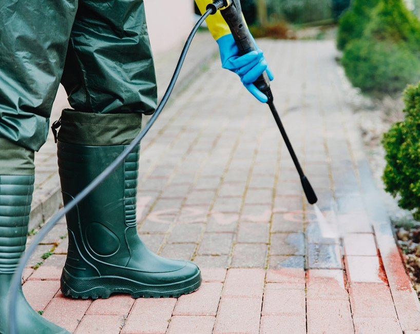 Person Power Washing a Red Brick Walkway — MDSR Group In Manunda, QLD
