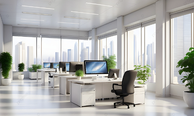 Bright modern office with white desks, computers, and large windows filled with plants