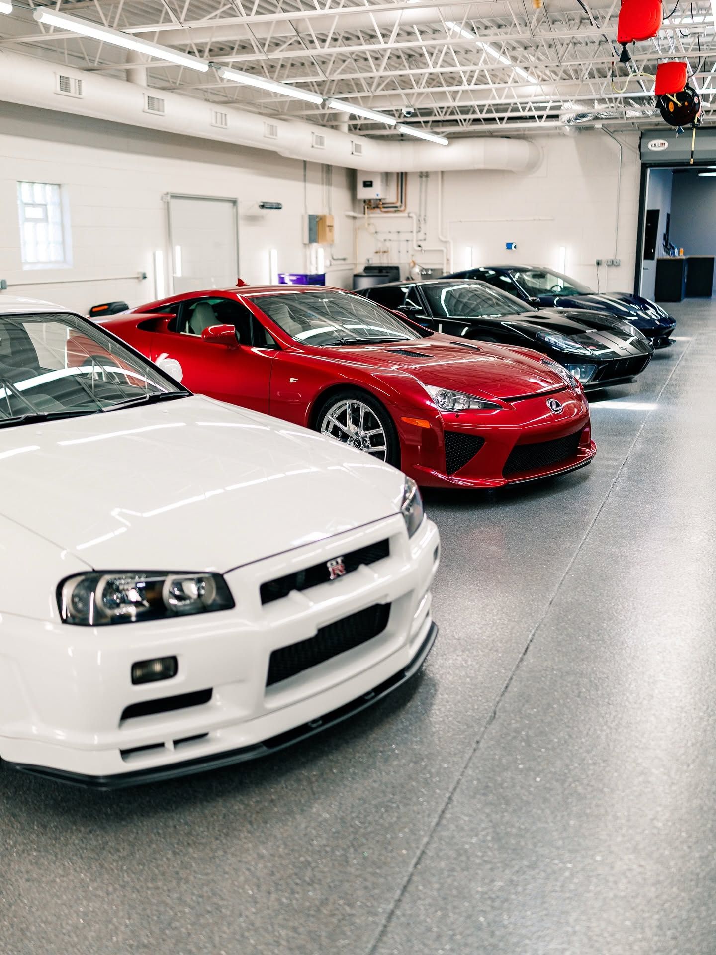 Luxury cars protected with paint protection film.