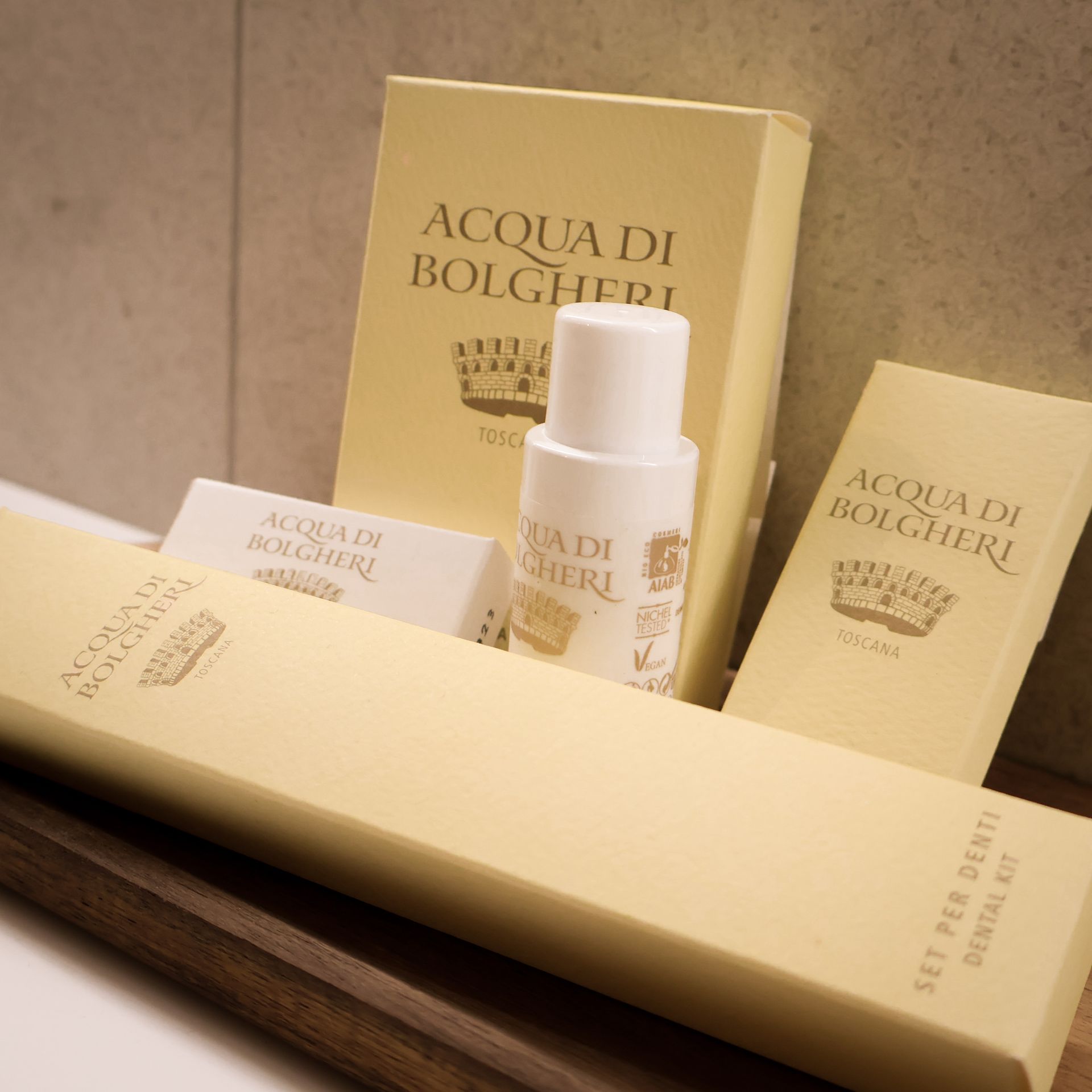 A bottle of acqua di bolgheri sits on a shelf