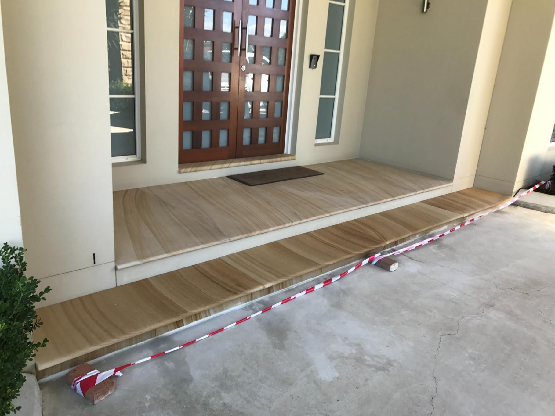 A House With A Wooden Porch And A Wooden Door — Lewis Landscapes In Wauchope, NSW