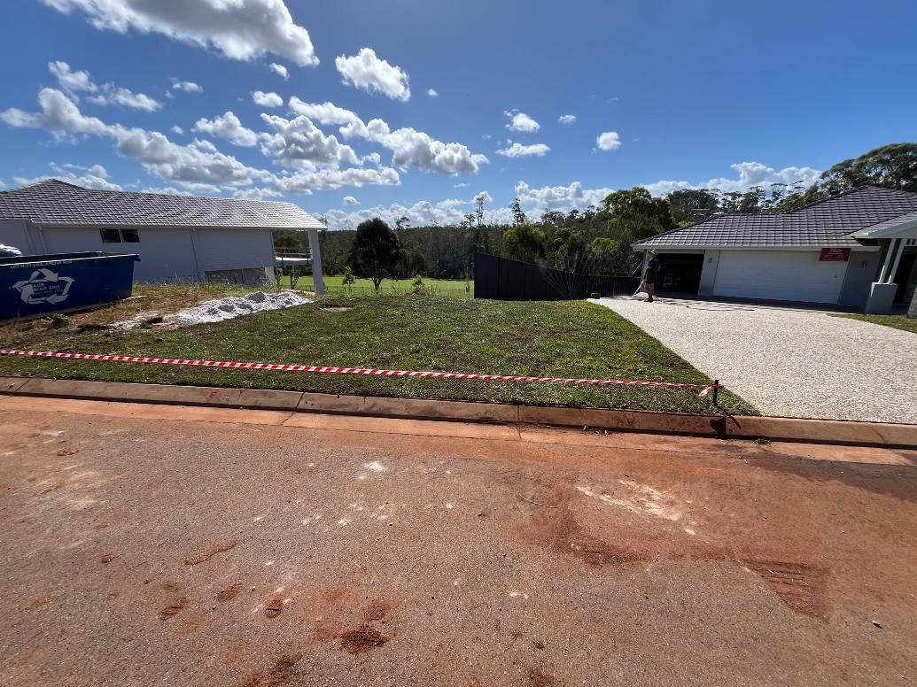 A House Is Being Built On A Dirt Lot Next To A Road — Lewis Landscapes In Yippin Creek, NSW