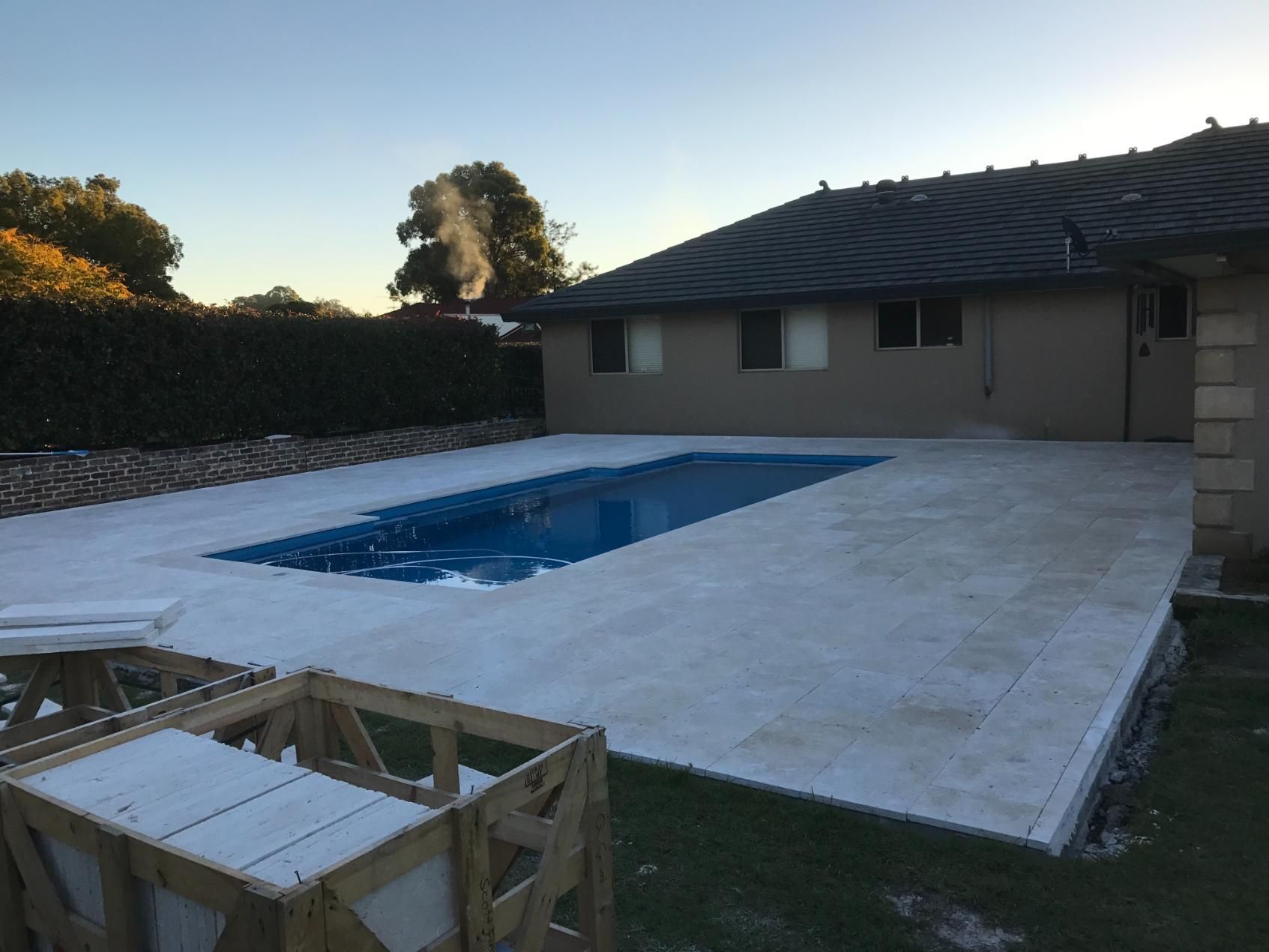 A House With A Large Swimming Pool In Front Of It — Lewis Landscapes In Yippin Creek, NSW