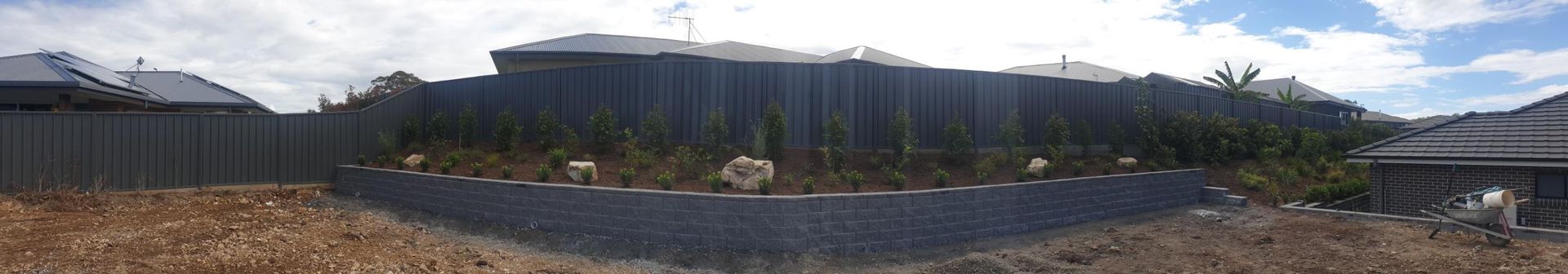 A Blurry Picture Of A House With A Fence In The Background — Lewis Landscapes In Yippin Creek, NSW