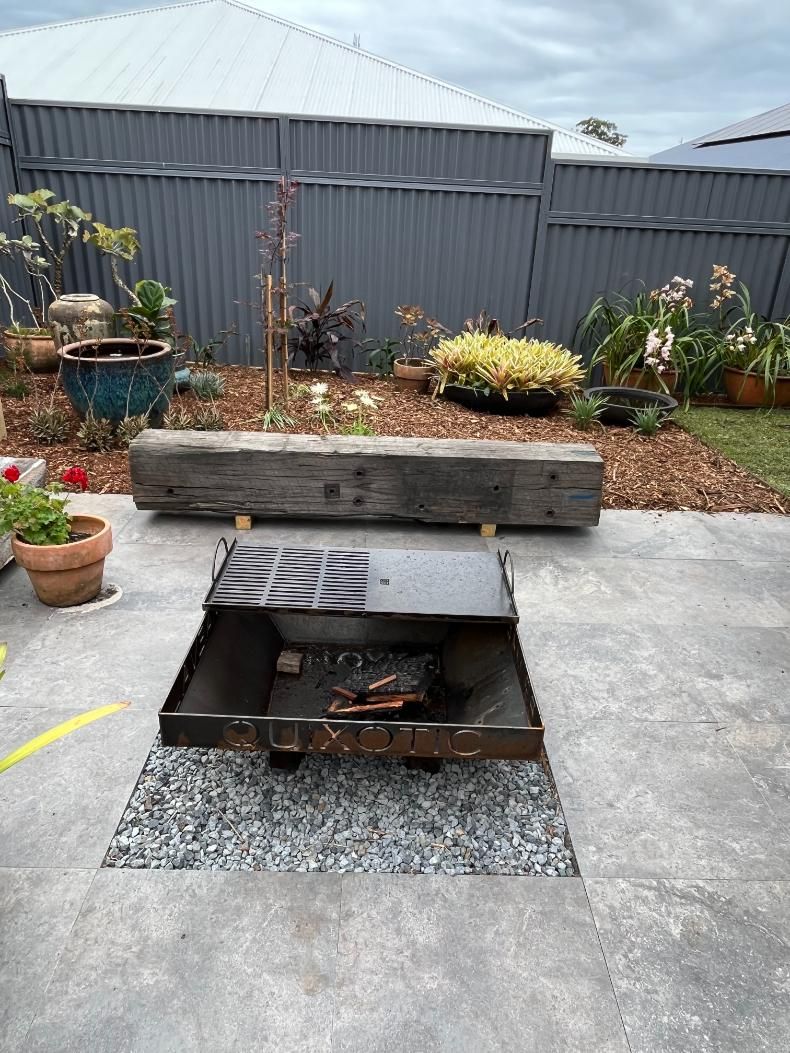 There Is A Fire Pit In The Middle Of The Patio — Lewis Landscapes In Wauchope, NSW
