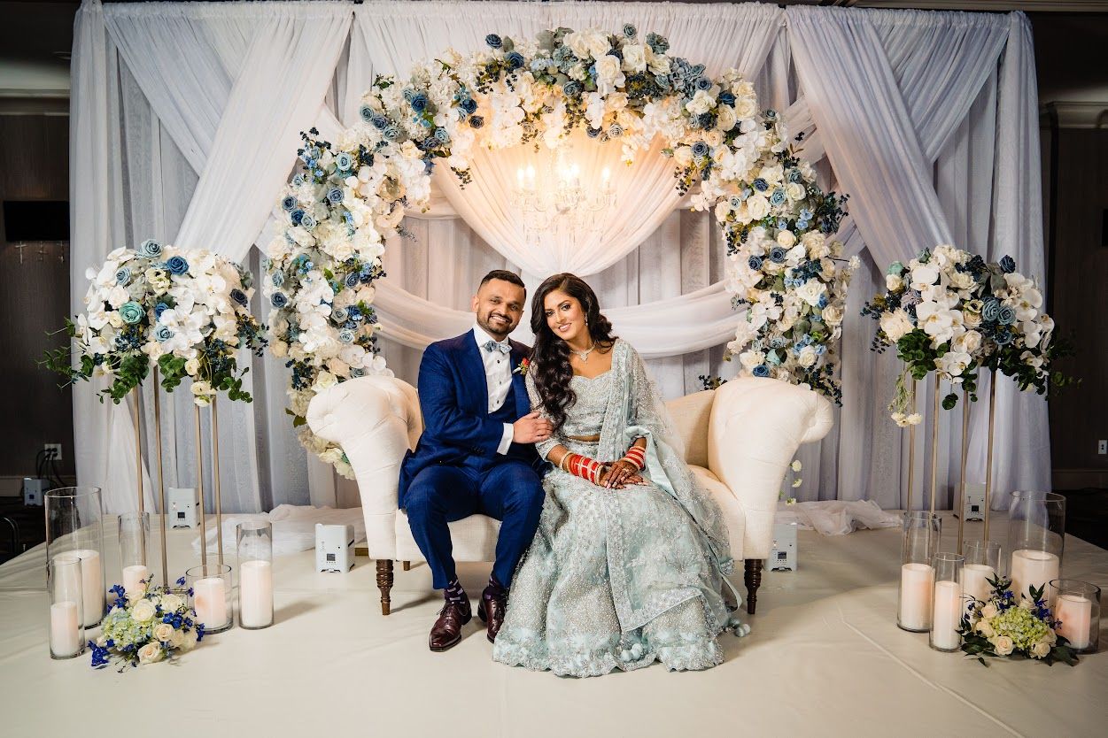 Couple Sitting in Front of an Arch Decoration