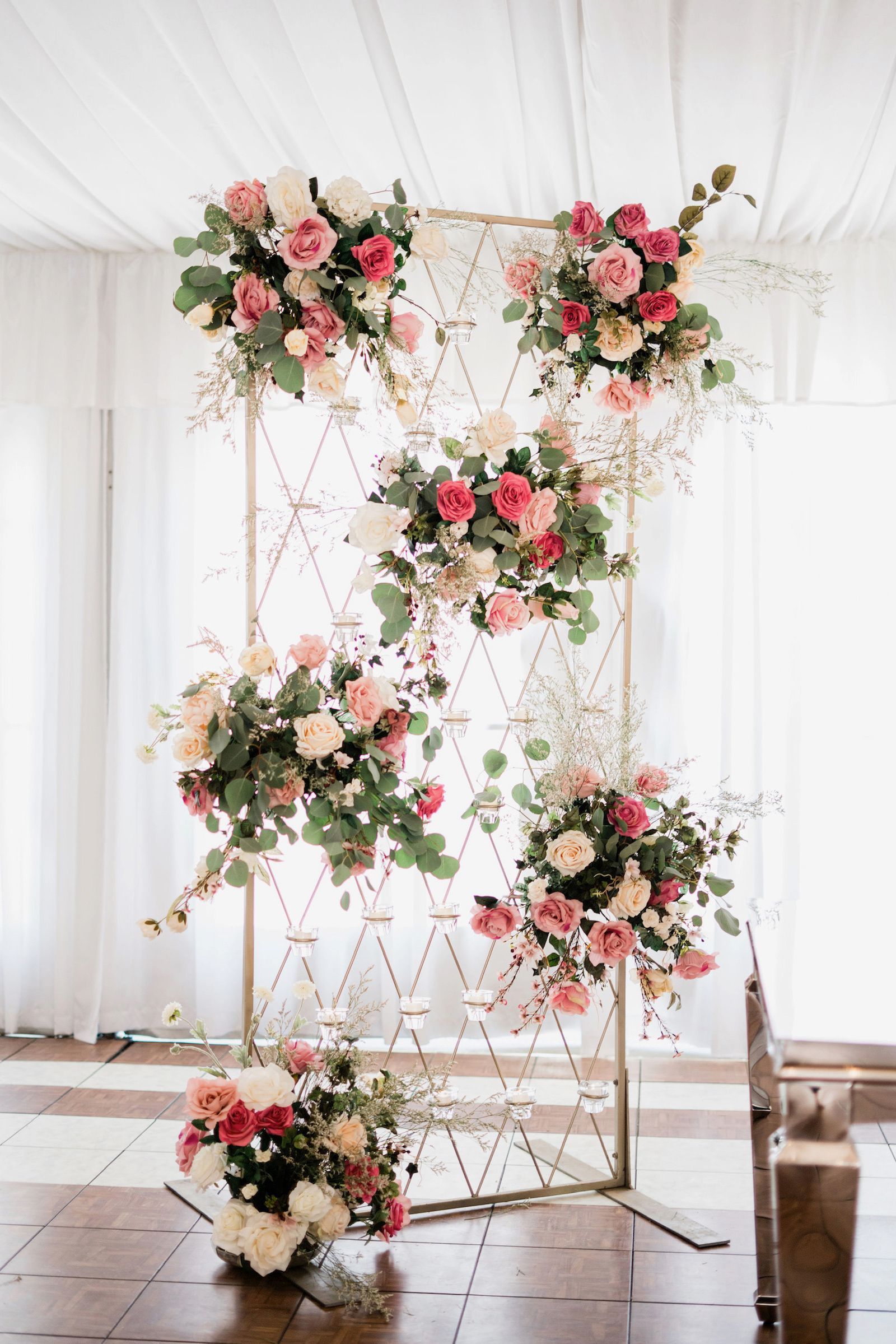 a floral backdrop with pink and white flowers on it