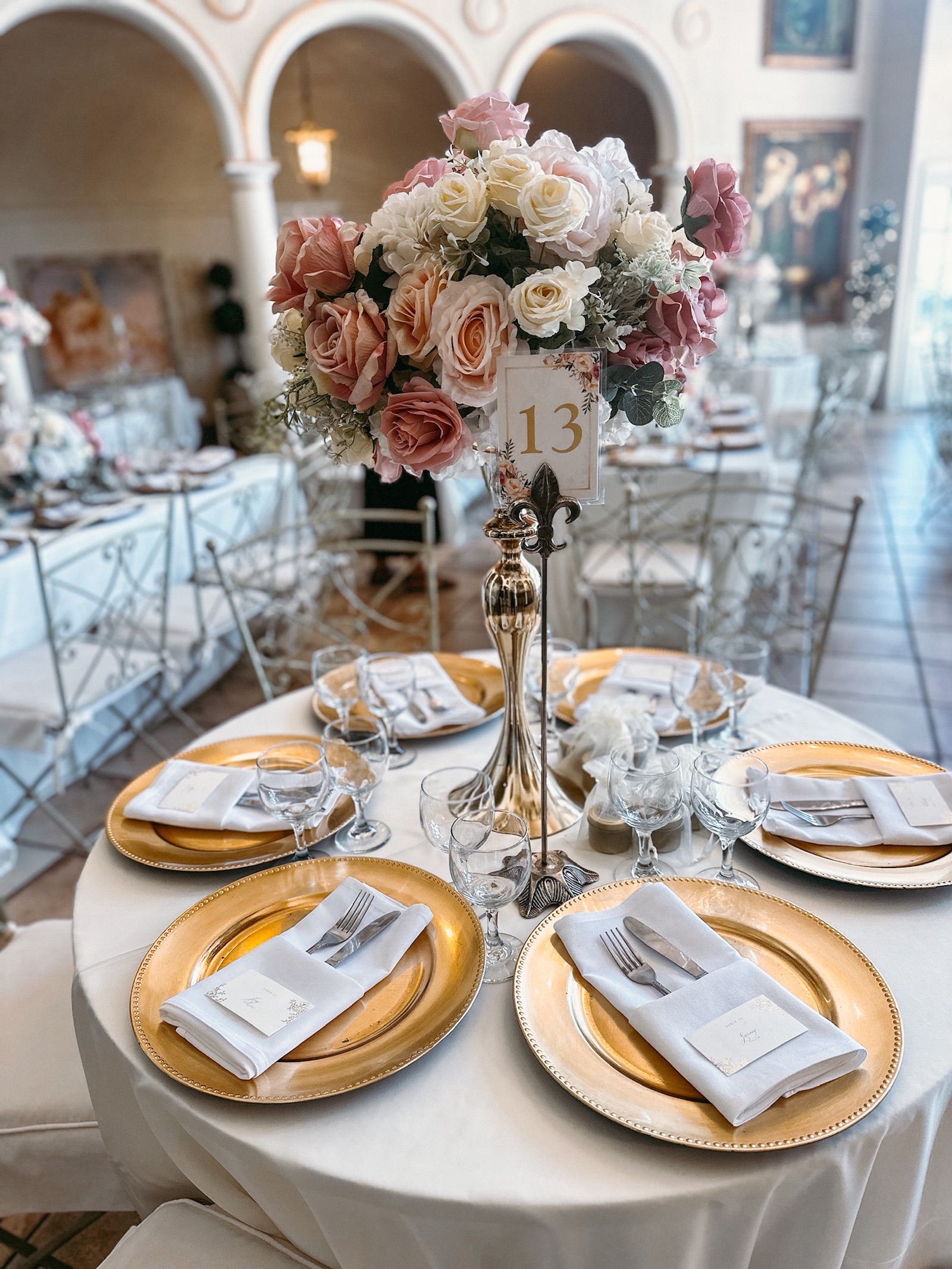 a table set for a wedding reception with the table number 13