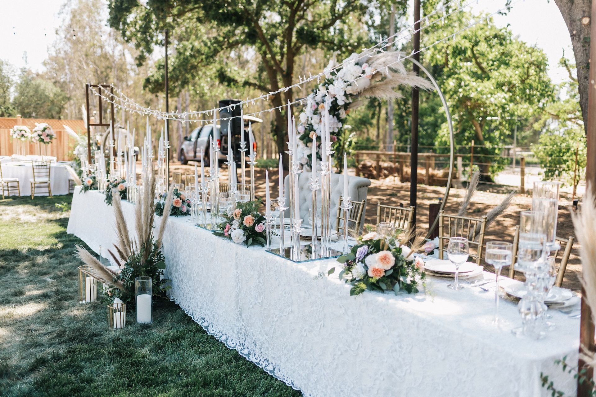 Designer Head Table with Floral Arrangements and Decorations