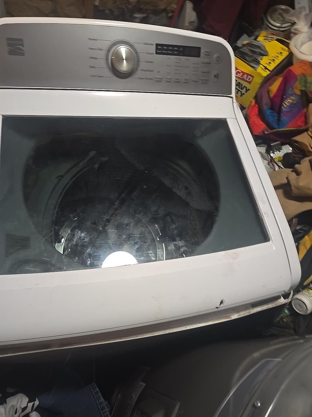 Technician installing a washer in a laundry room
