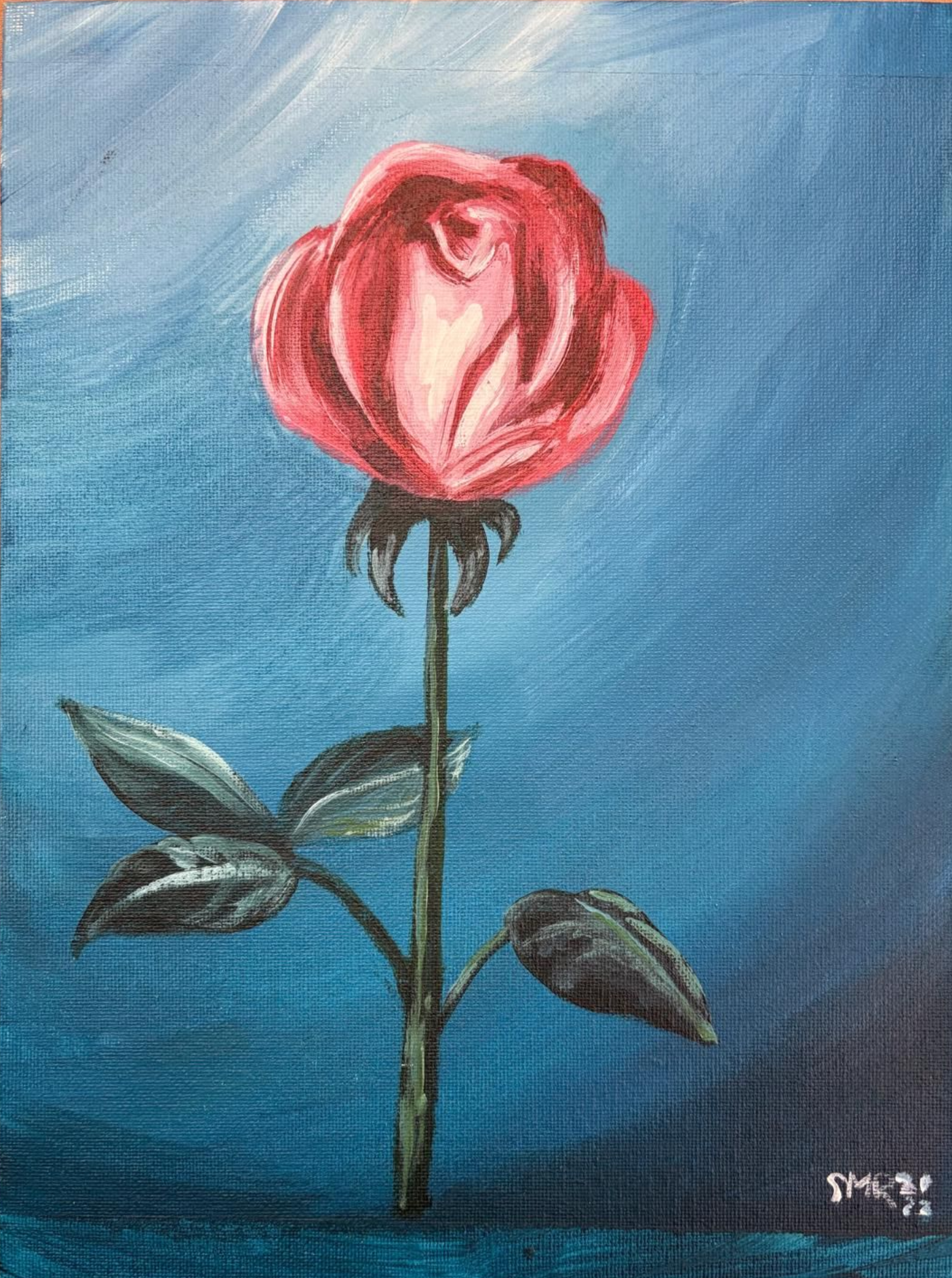 Red rose against a blue background, with green leaves on a stem.