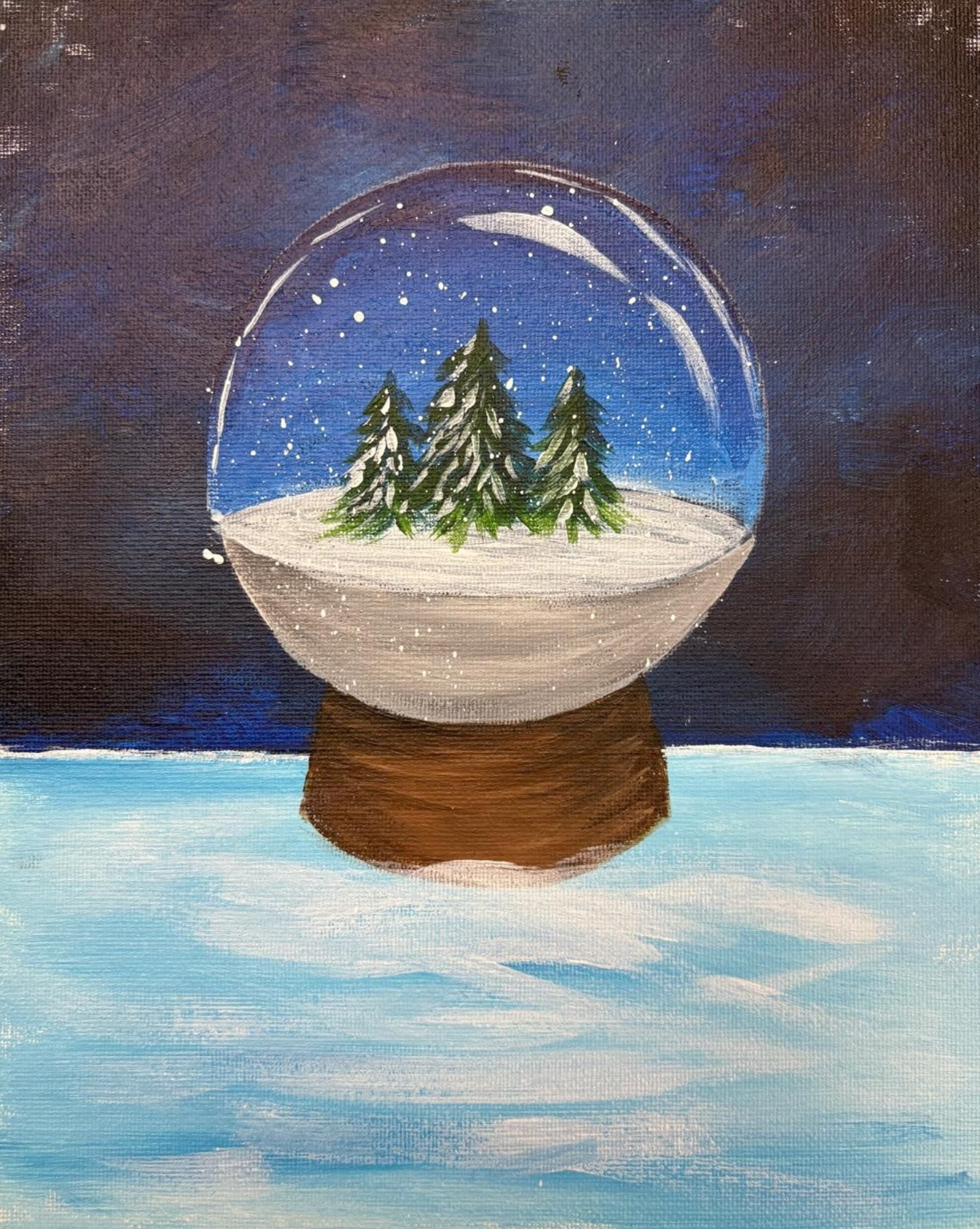 Snow globe painting with trees, snow, and a dark blue night sky. Brown base with a light blue foreground.
