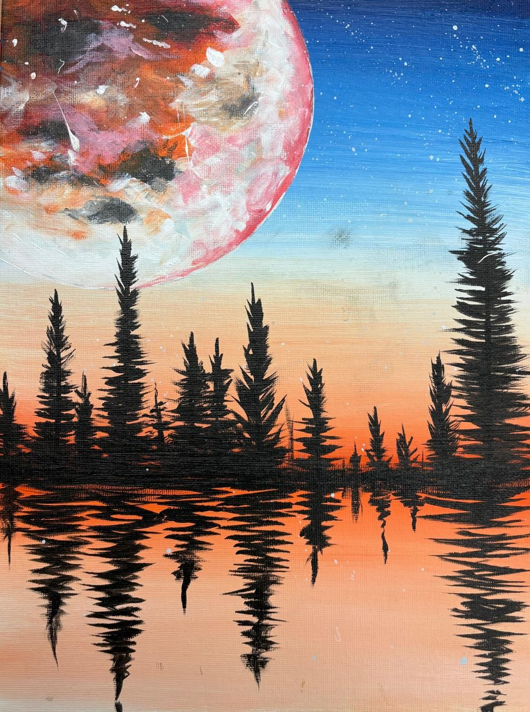 Full moon over a silhouetted forest reflecting in the water, with orange and blue sky.