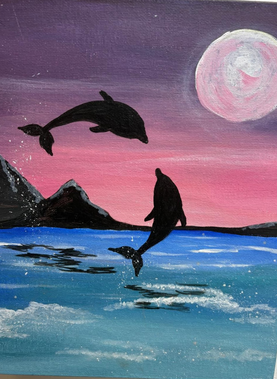 Two dolphins leaping from ocean under a moonlit sky. Mountains in the background, pink and purple hues.