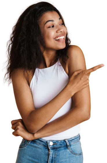 A woman in a white tank top and blue jeans is pointing to the side.