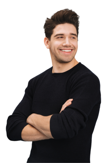 A man in a black sweater is smiling with his arms crossed