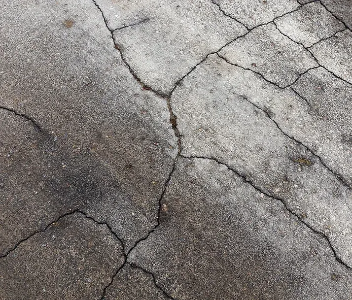 cracked concrete being hauled away