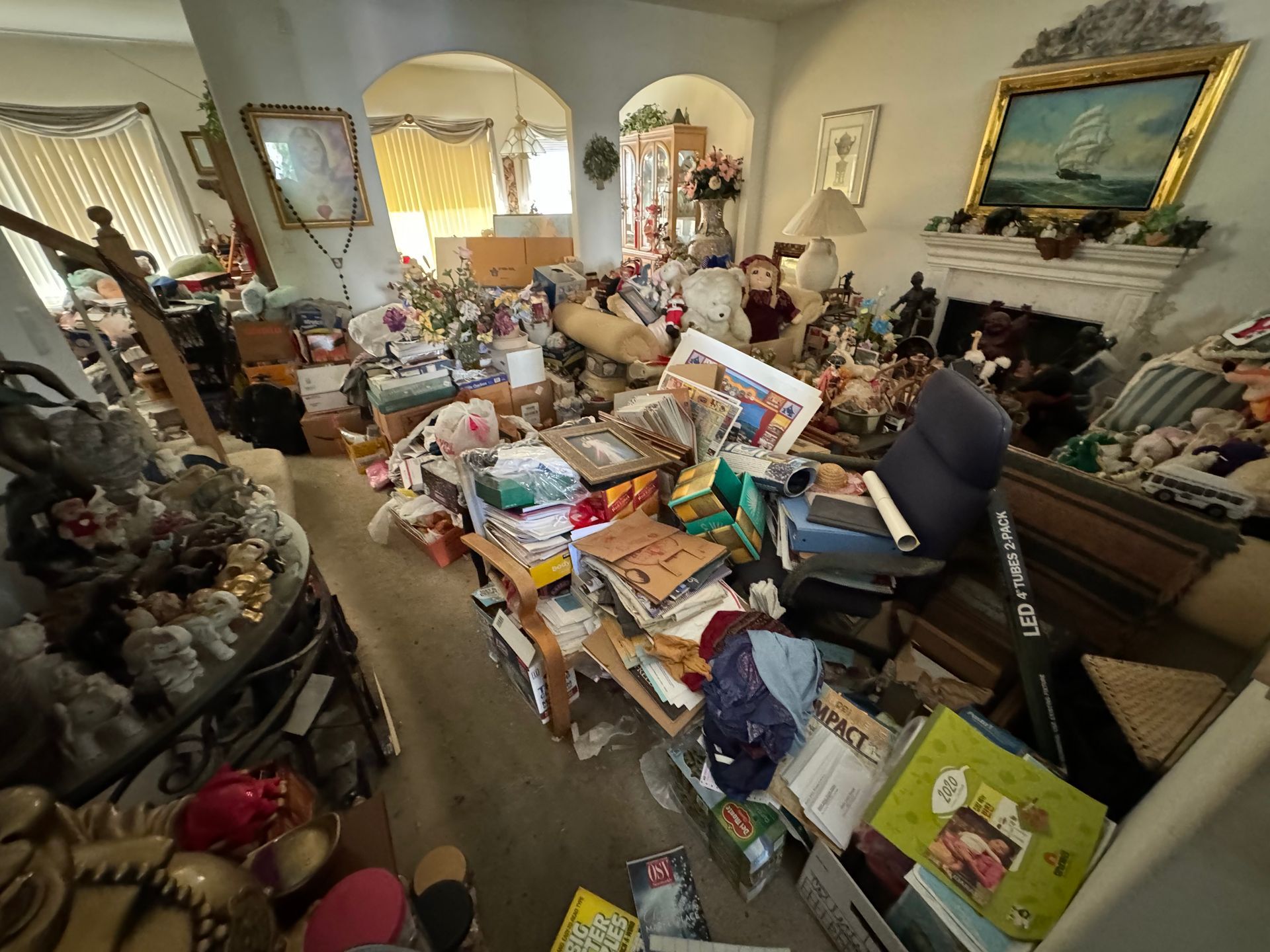 Cluttered living room before a hoarder cleanout in Torrance