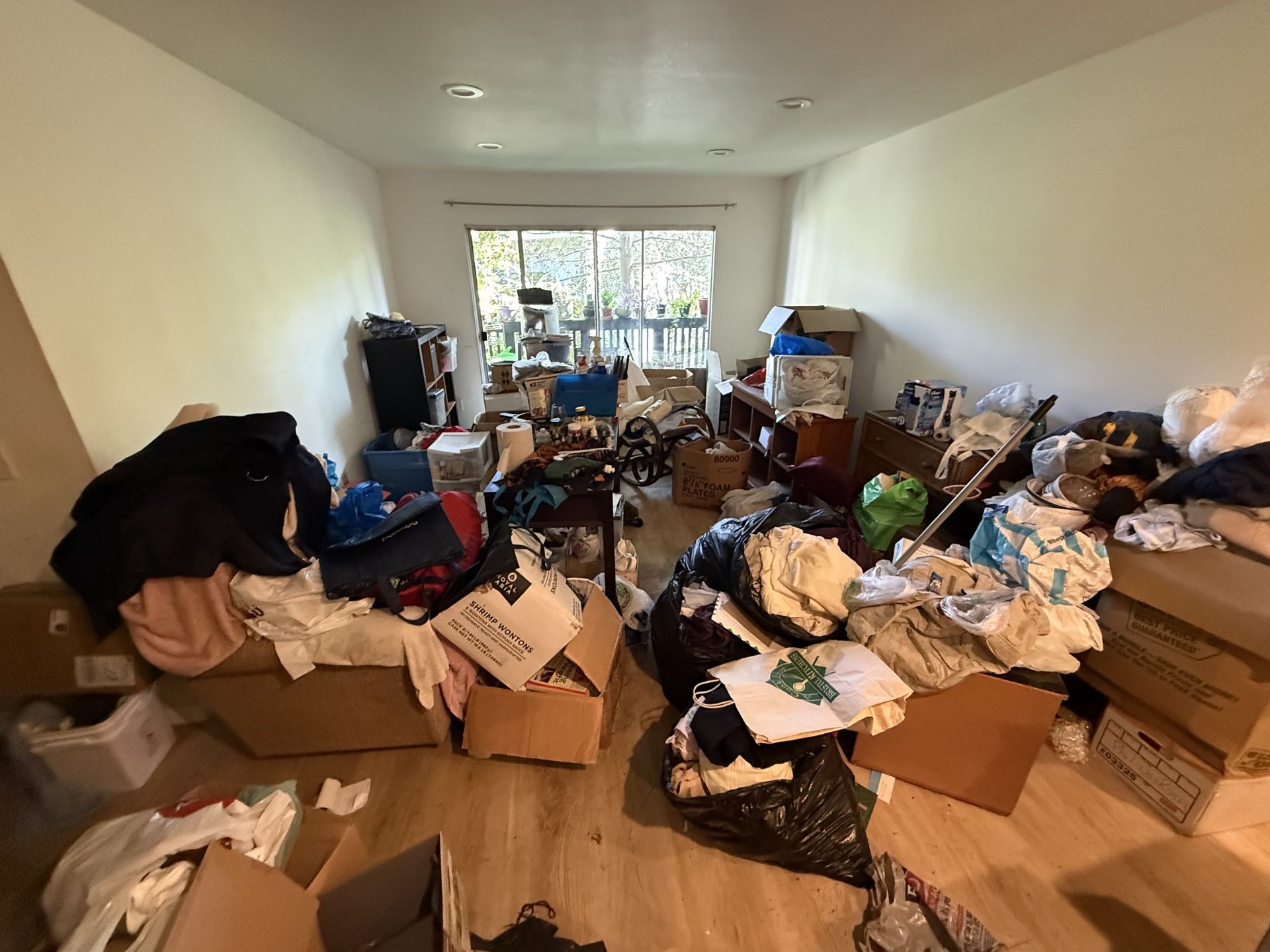 Cluttered living room before a hoarder cleanout in Rancho Palos Verdes