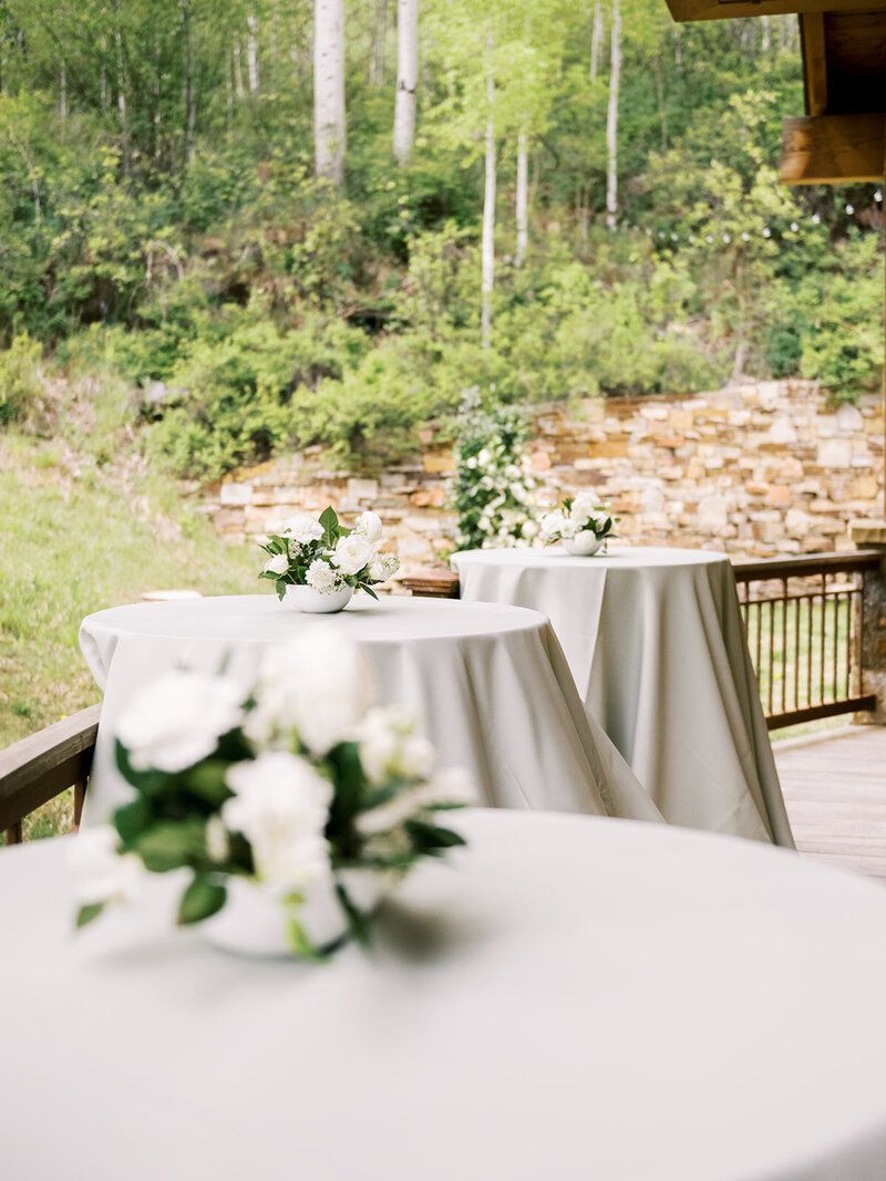 A table with a vase of flowers on it.