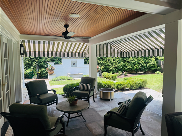 One family house, wooden terrace with awnings in the evening. One family house, wooden terrace with awnings in the evening.