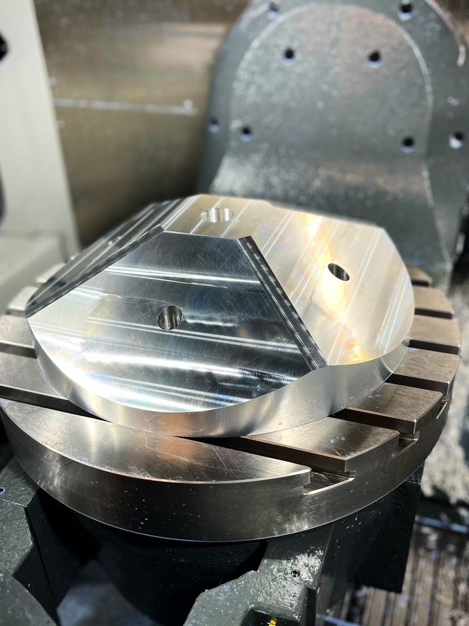 a machine is being used to cut a piece of metal