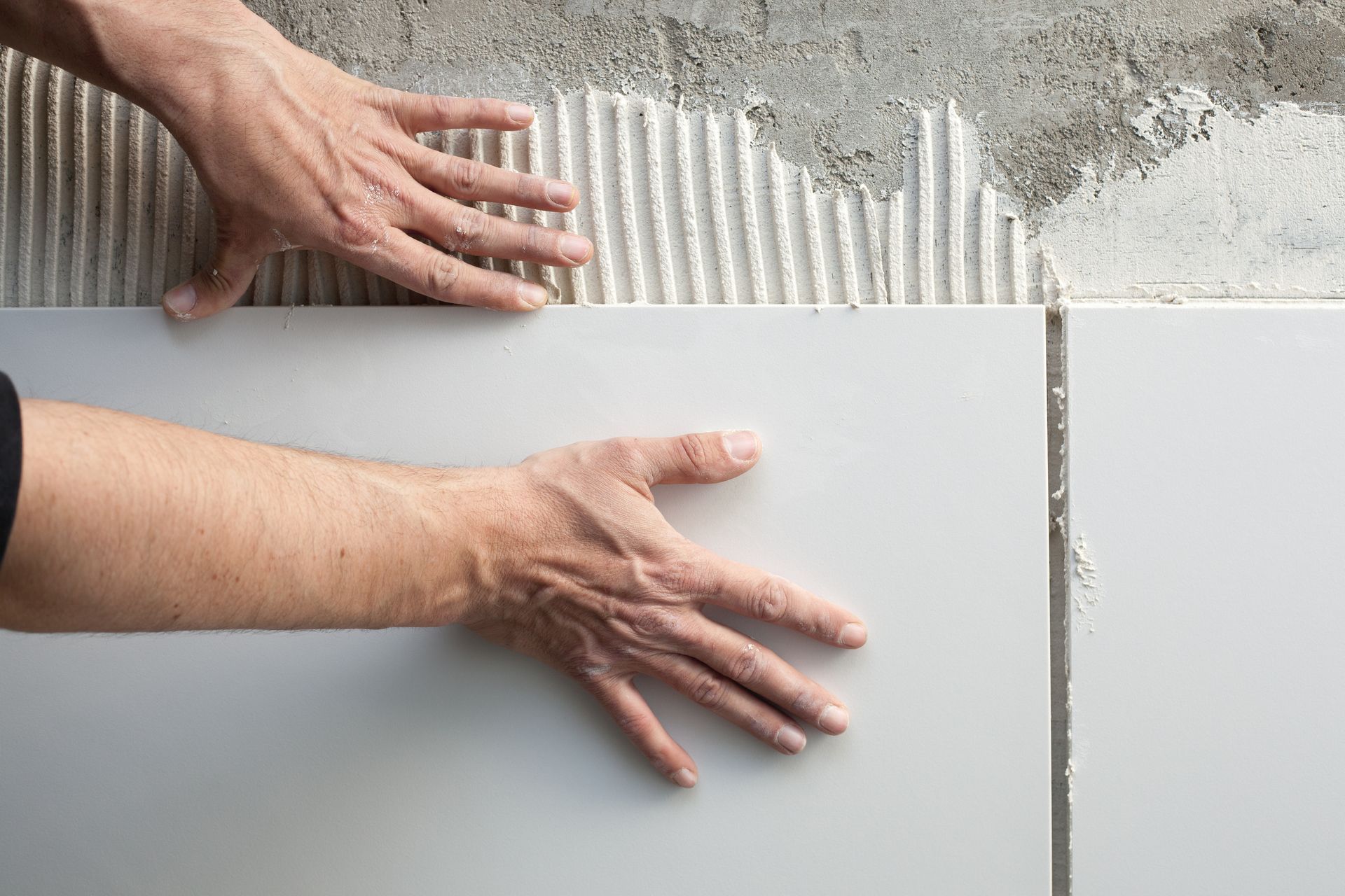 A Man is tiling — Sunny Tiling Co in Mount Coolum, QLD