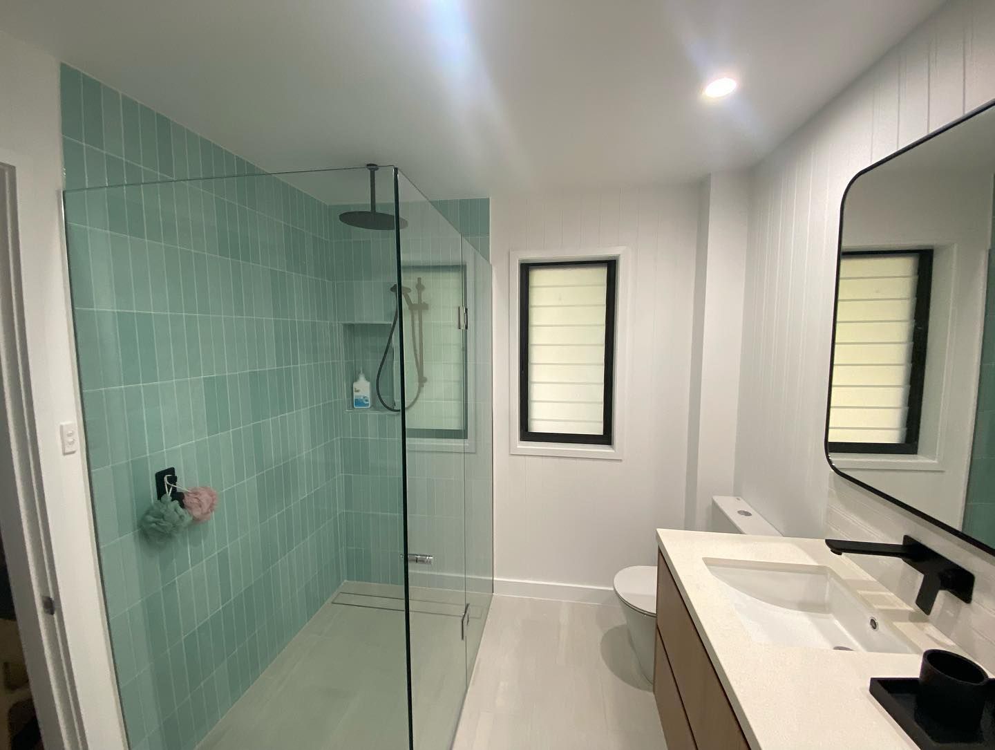 A Bathroom with Turquoise Tiled Shower — Coastline Building & Renovations In Smiths Lake, NSW