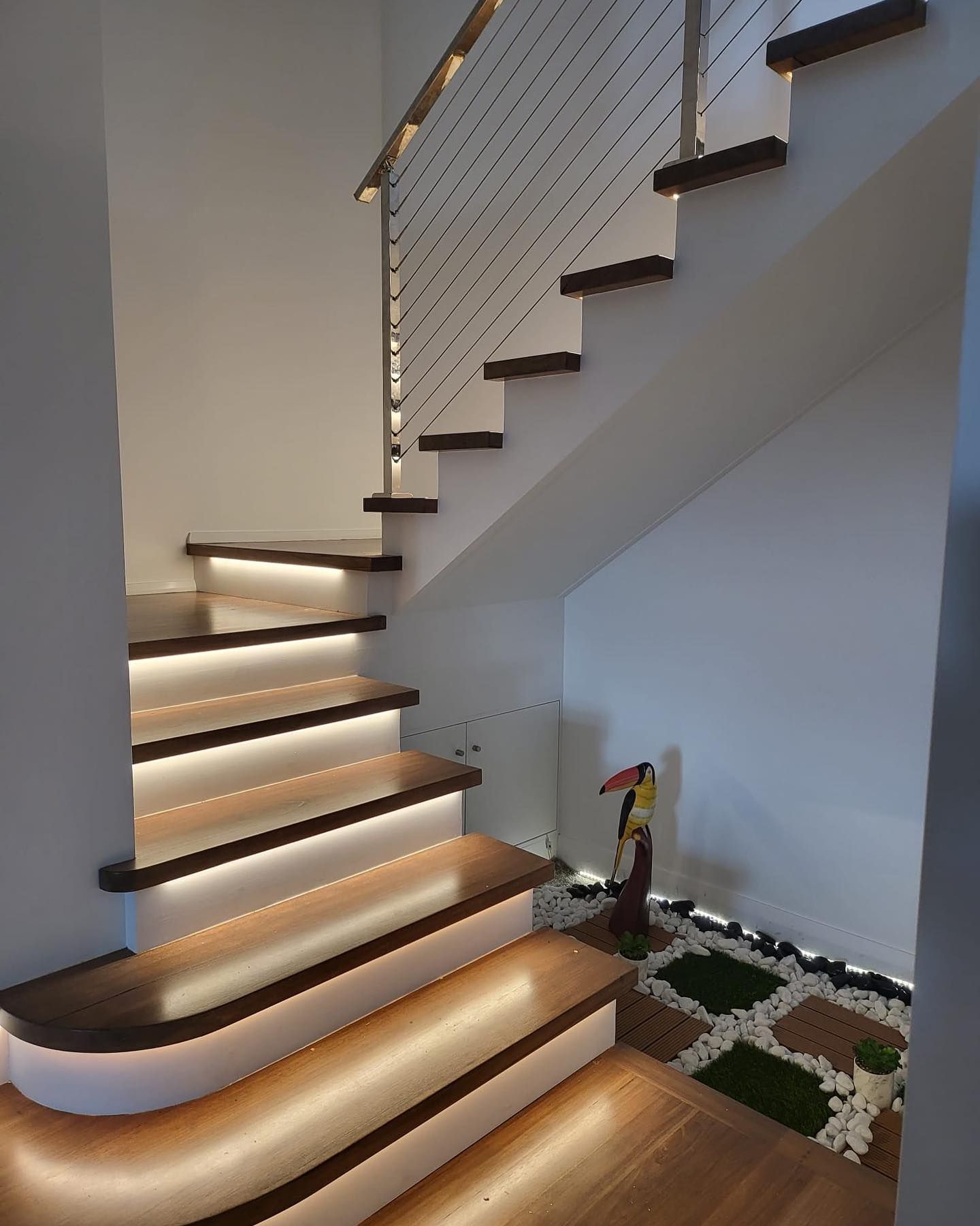 A Wooden Staircase with Lighting and Metal Railing — Coastline Building & Renovations In Forster, NSW
