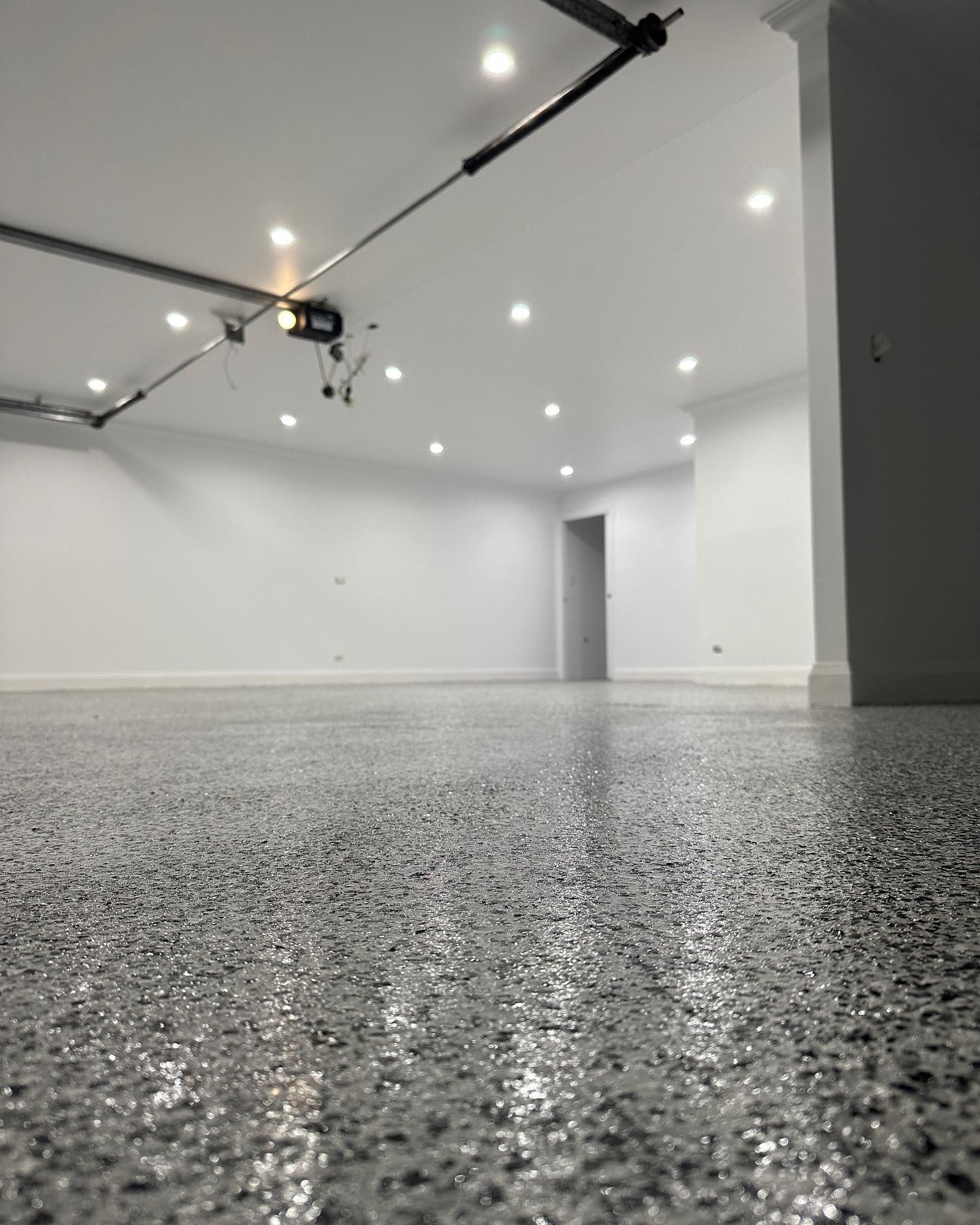 A Garage with Glossy Speckled Floor — Coastline Building & Renovations In Forster, NSW