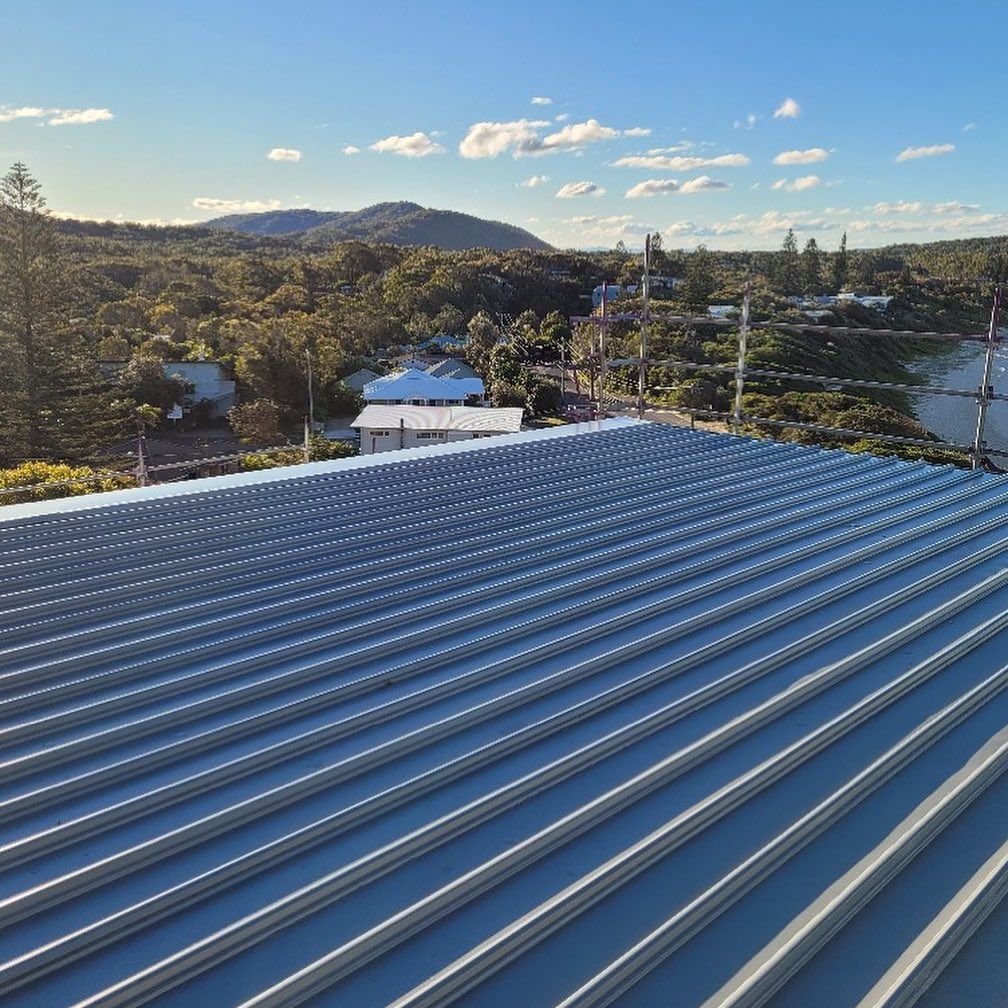 A Corrugated Metal Roof with A Scenic Landscape — Coastline Building & Renovations In Forster, NSW