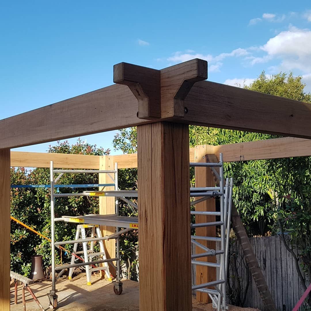 A Wooden Pergola Corner Joint with Scaffolding — Coastline Building & Renovations In Forster, NSW