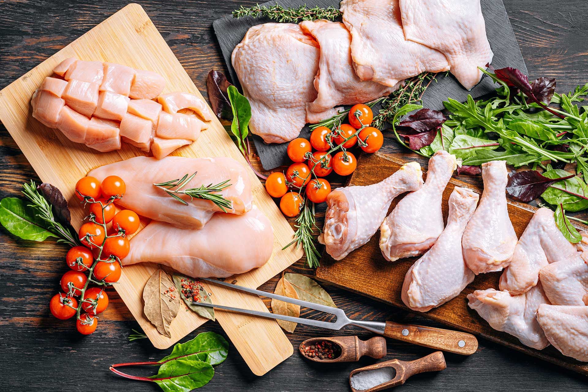 Prepared for frying, butchered various portions of raw chicken meat.