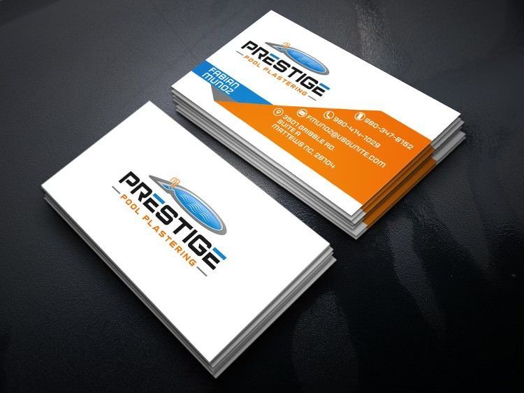 Stack of white business cards with orange and blue accents on a dark surface, branded “Prestige”