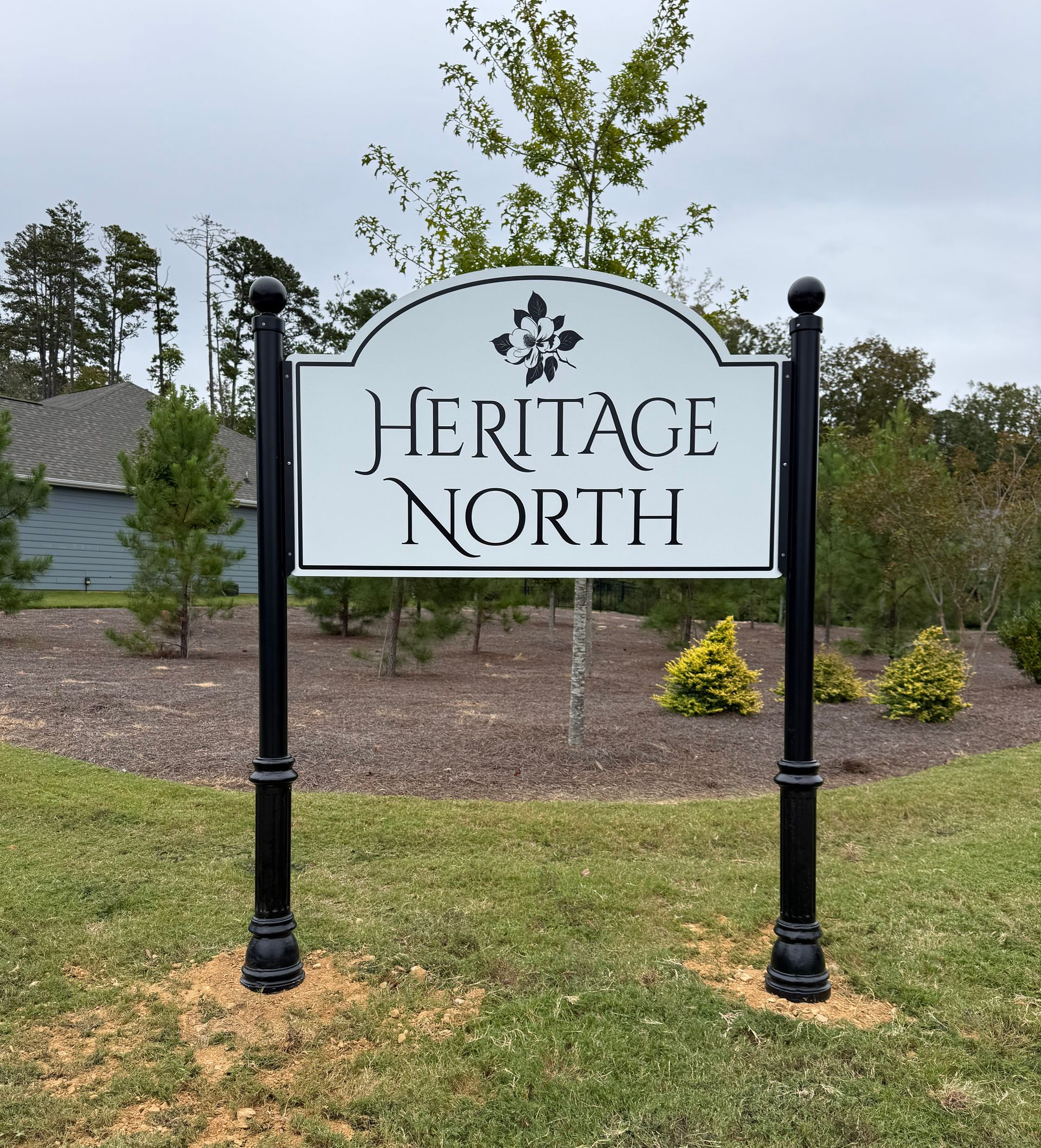 Heritage North neighborhood sign on a landscaped roadside entrance