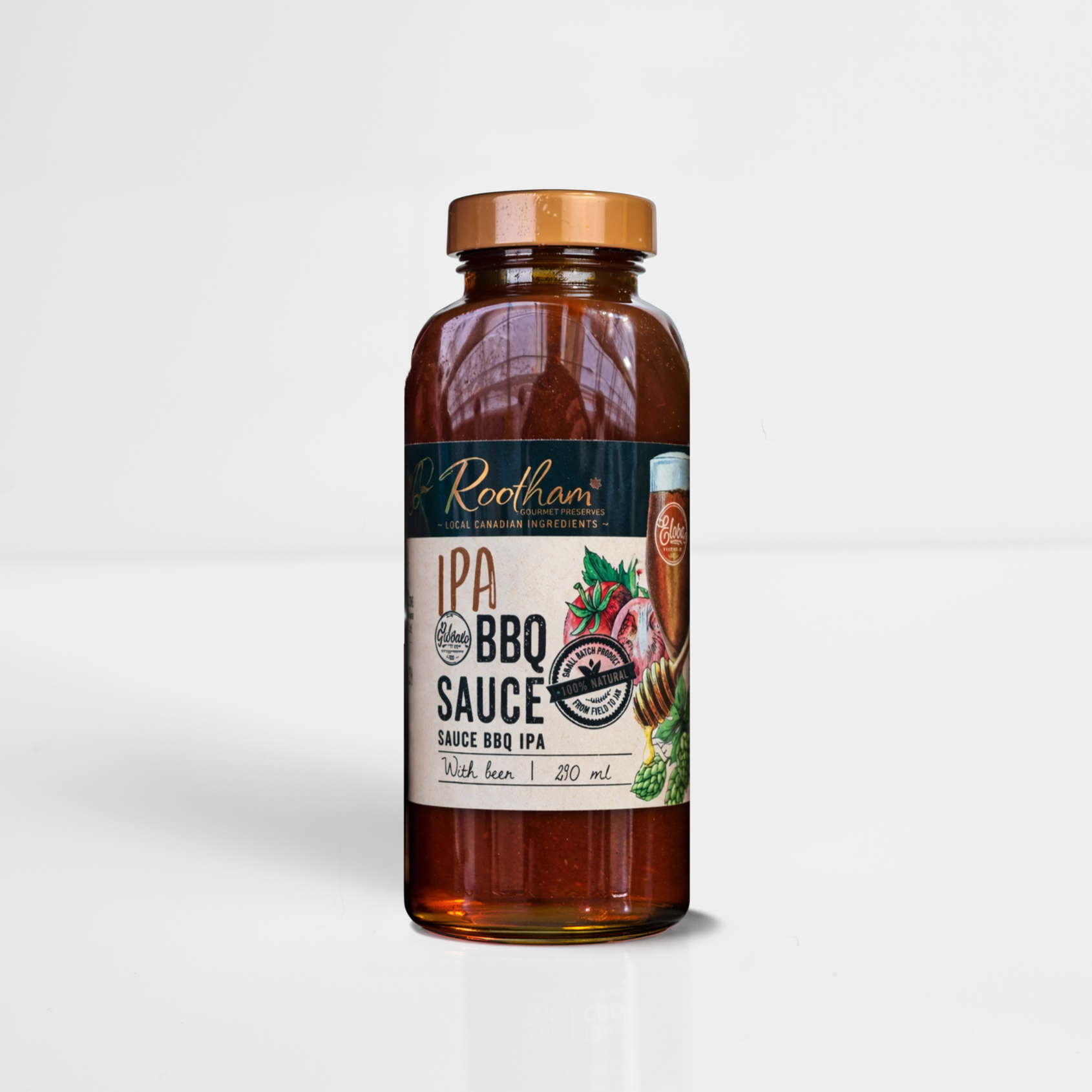 Amber bottle of Roasters IPA BBQ sauce with copper cap on a white background