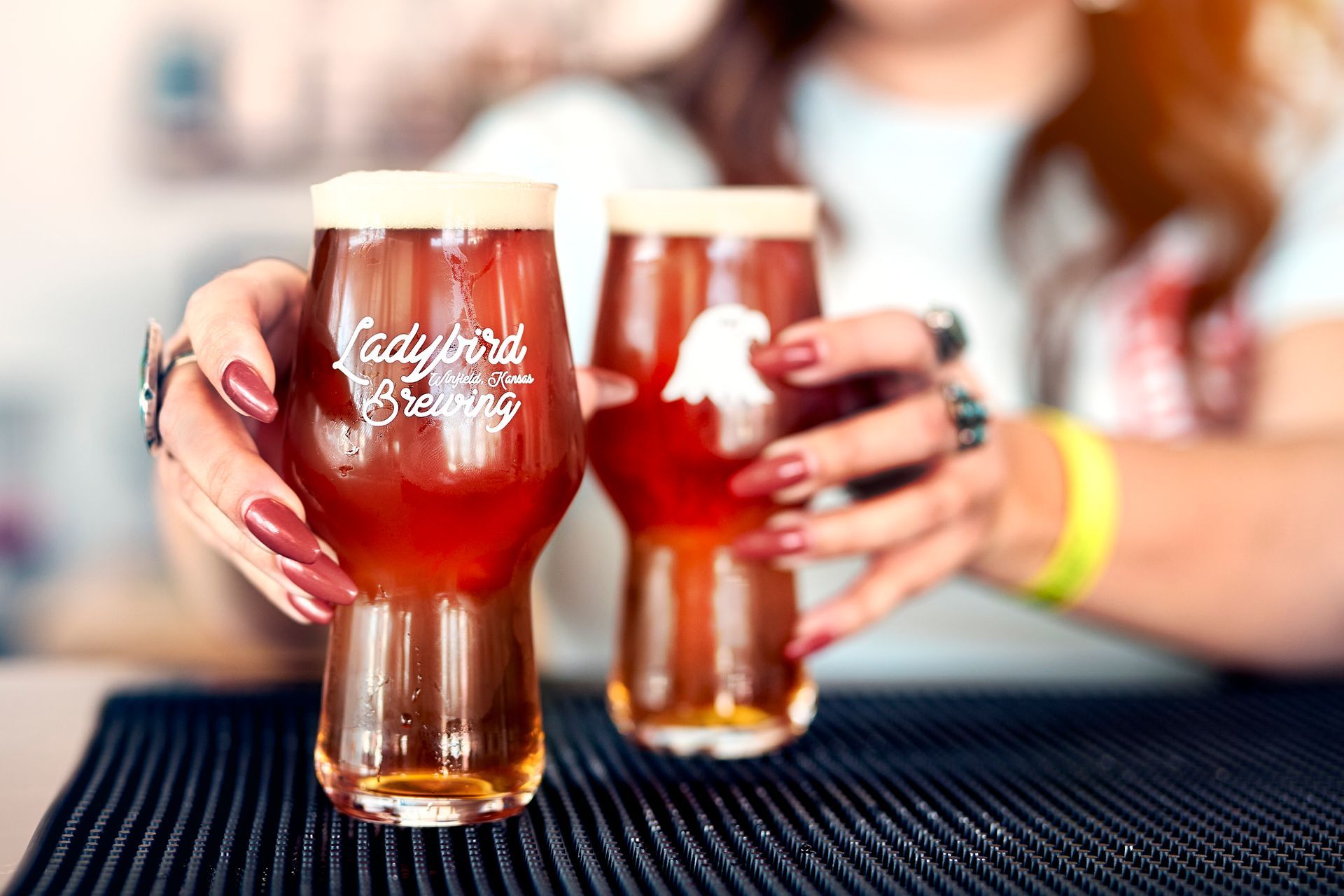 Ladies holding brews at Ladybird Brewing