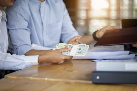 man holding bunch of money