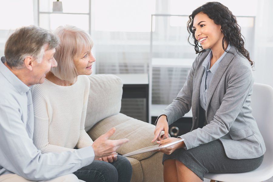 couple talking to a woman