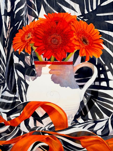 Orange and red gerbera daisies with black and white cloth background.