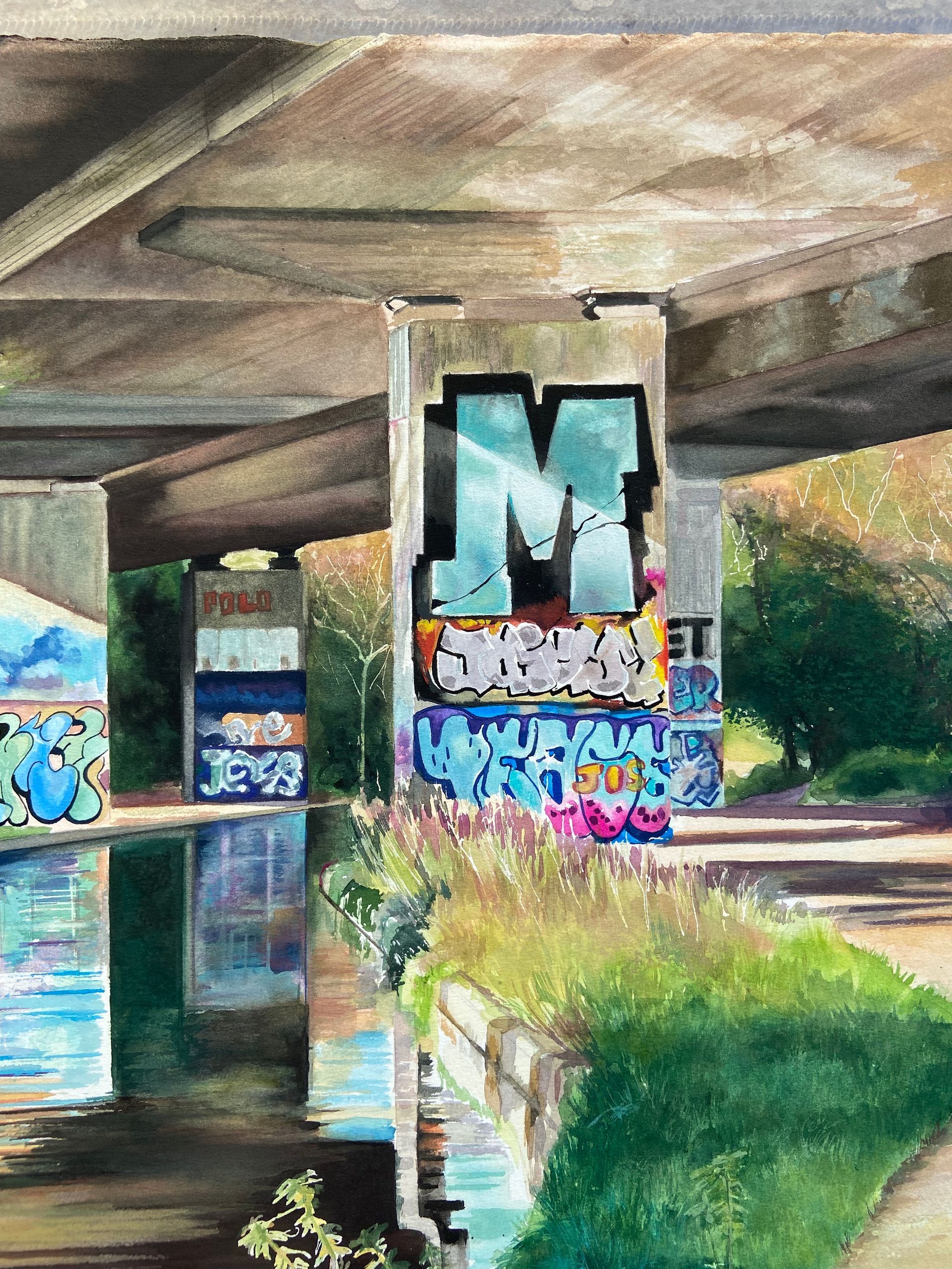 canal painting with vivid water reflections of graffiti below M25