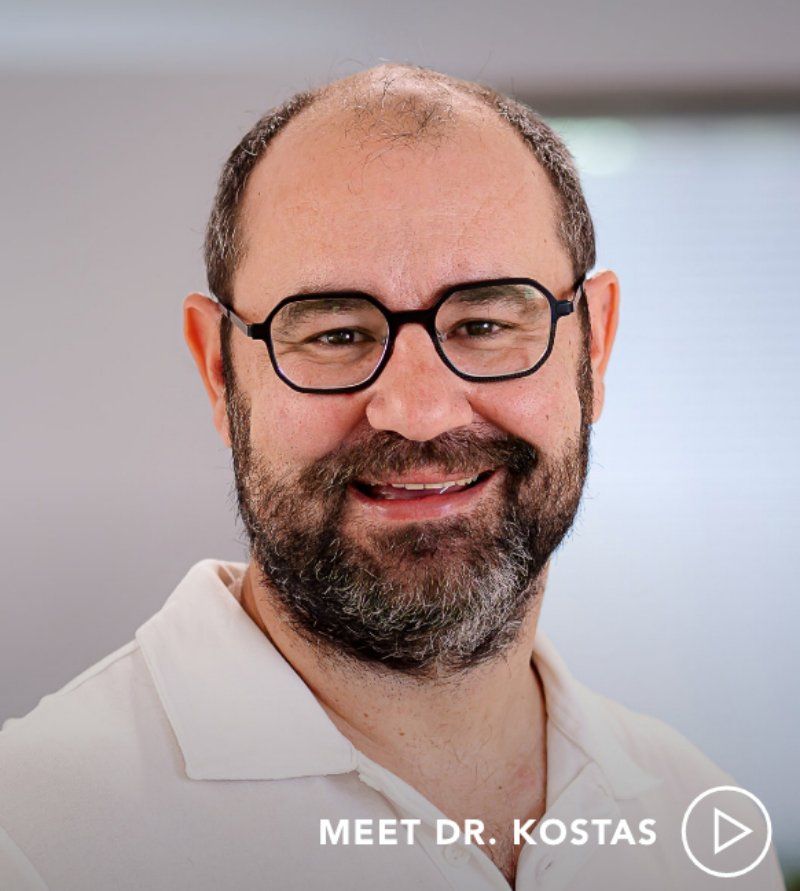 Man with beard and glasses smiling at the camera; text reads